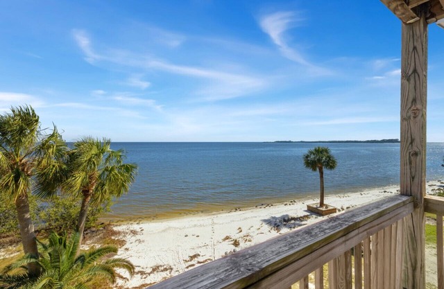 Waterfront condo with king bed and large sunrise deck