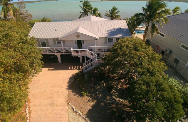 Waterfront home with open water view, dock, hot tub, private beach, dog friendly