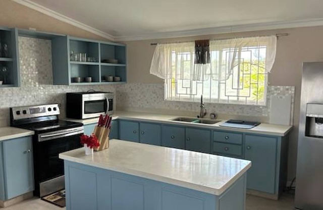 Welcome to Hope Winds, a charming property ranch-style house on a seren
