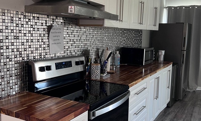 Calgary Apartment | 10 mins from airport, walkout basement apt.