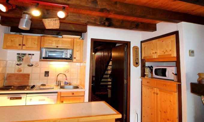 Champagny-en-Vanoise Apartment | 100m from resort center, 2nd floor, balcony, fireplace or stove, tv, ski locker, 55m²