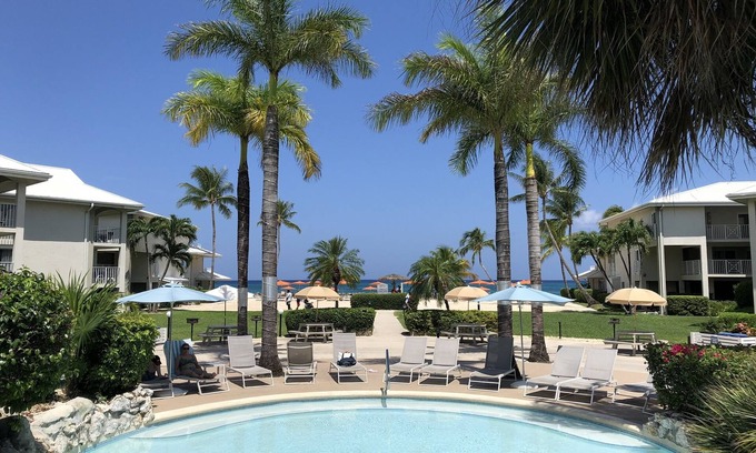 Seven Mile Beach Condo | 1st Floor POOLSIDE/OCEAN VIEW Protected Cove & Beach-Most 10 Star Reviews on 7MB