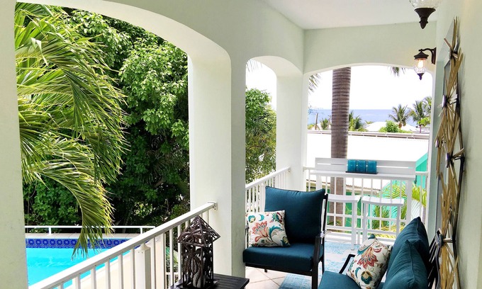 Estate Enighed Condo | 2 master suites. 4 bedroom. Walk to town. Total rennovation. Poolside villa.