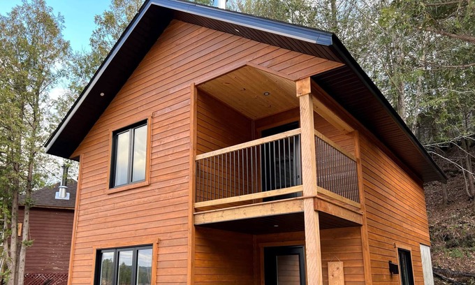 Bowman Ski Chalet | [# 2 The Dog] Cottage on the banks of the river.