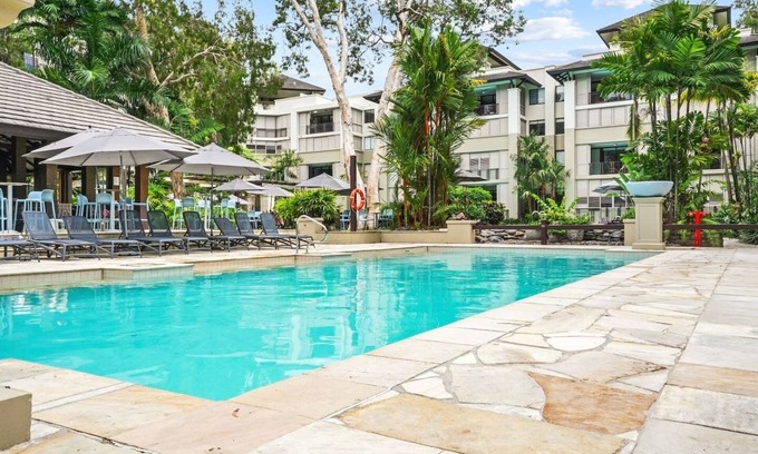 Palm Cove Apartment | 235 Temple Tranquility: Triton Retreat- Luxury Studio in Palm Cove | Private Stay with Resort Pools & Balcony