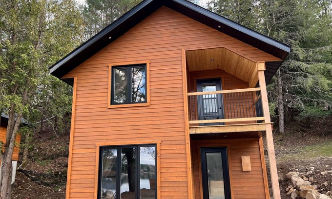 Bowman Ski Chalet | [# 4 The Raven] Chalet on the banks of the river.