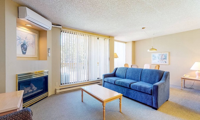 Upper Village Condo | 4th-floor condo with heated pool, hot tub, gym, balcony, fireplace, W/D, sauna