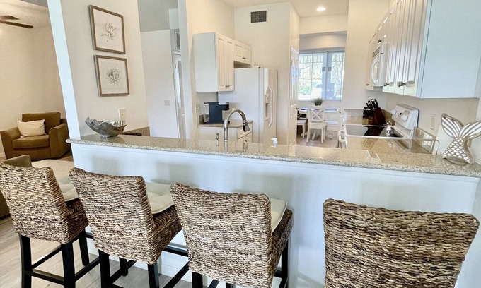 Naples Condo | 5 Star reviews! 1st floor coastal condo Pretty fountain views! Free Golf May-Oct