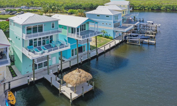 Cape Harbour House | 5862 Shell Cove Drive. Funky Fish House at Cape Harbour. on Marina with dock