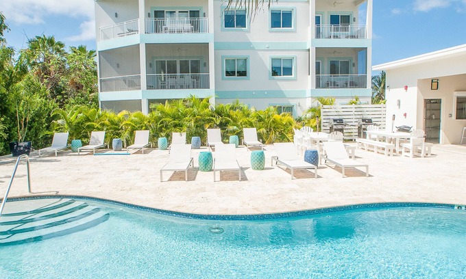 West Bay Condo | 7 Mile Beach Penthouse with Private Beach Club. Ocean views from Roof Terrace.