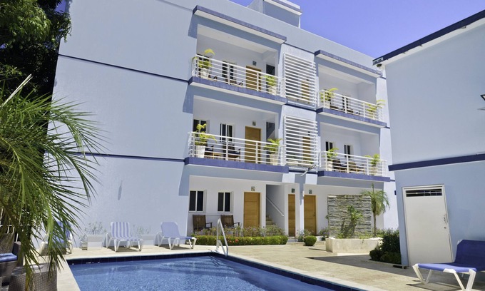 Urbanizacion Tavarez Condo | A downtown one bedroom 1.5 bath condo with onsite CigarLounge and bar!