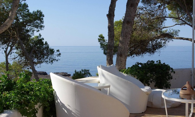Portopetro Villa | A large villa with garden and terraces at the water's edge