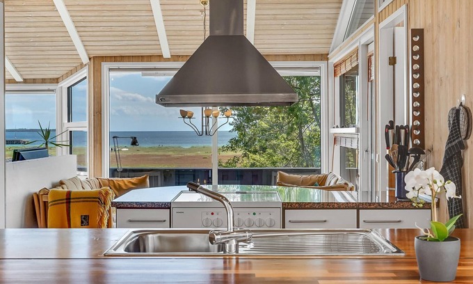 Lyngsbæk Strand House | A magnificent panorama awaits you in this beautiful vacation home.