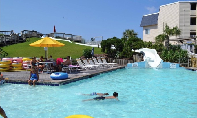 Morehead City Condo | A Place at the Beach resort Family Fun!150'Waterslide, indoor pool&Putt Putt