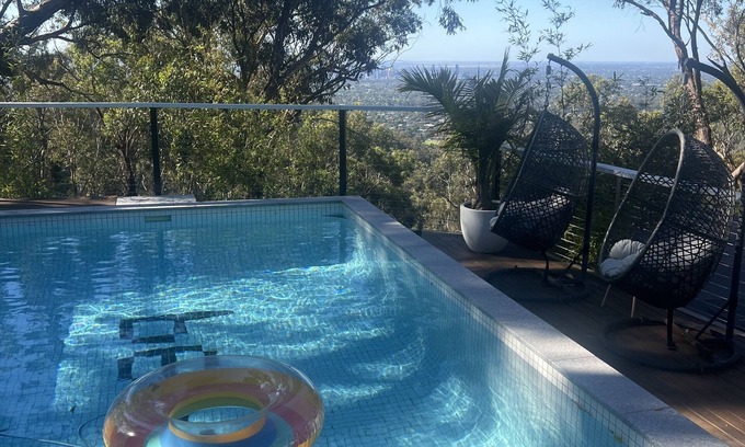 Belair Apartment | A place to relax in peace. Spa, fire pit, city lights and a pool.