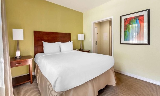 West Kissimmee Hotel | A Place You'll Surely Enjoy! Outdoor Pool, Full Kitchen, Free Shuttle!