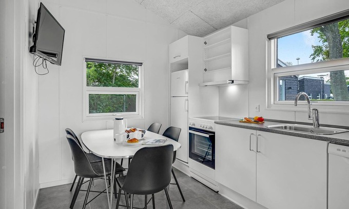 Assens House | A small cottage awaits you here, located on a campsite with a playground.