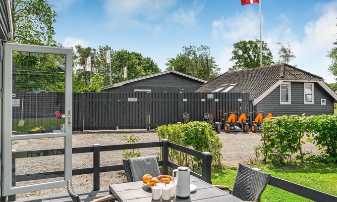 Assens House | A small cottage awaits you here, located on a campsite with a playground.
