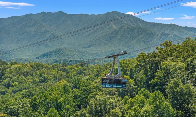 Chalet Village Cabin | A Tram View-Mountain views and watch Gatlinburg historic cable tram passes by