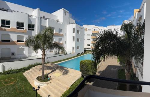 Achakkar Apartment | Achakkar Hills Seaside Family Apartment with Pool, Beach Access, AC, Parking, Play Area