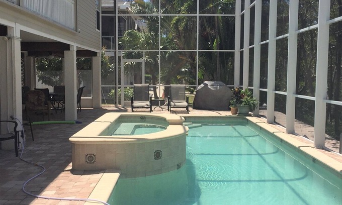 Mid Island House | All remodeled and ready after Hurricane Ian! Pool with Canal View