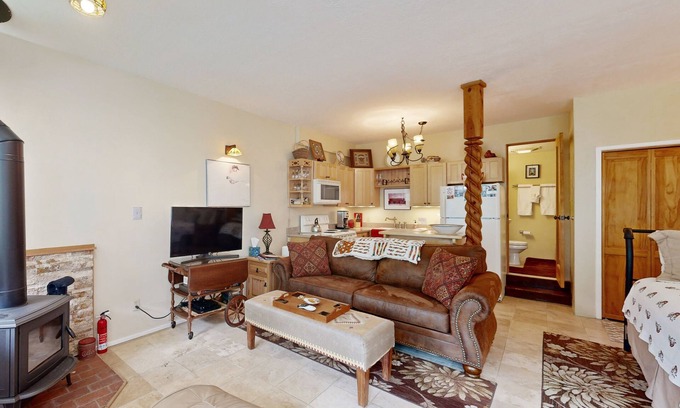 Taos Ski Valley Condo | Amazing condo with river & mountain views, hot tub, & wood-burning fireplace