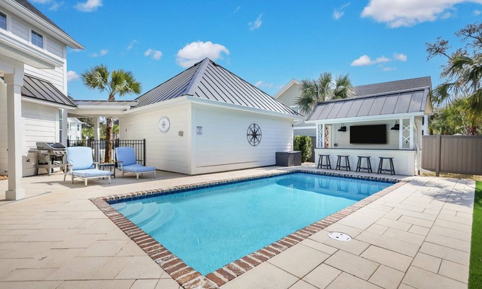 Saint Simons Island House | Amazing Island Oasis, Heated Pool, Outdoor Bar Area with TV, Bocce Ball Court & Putting Green