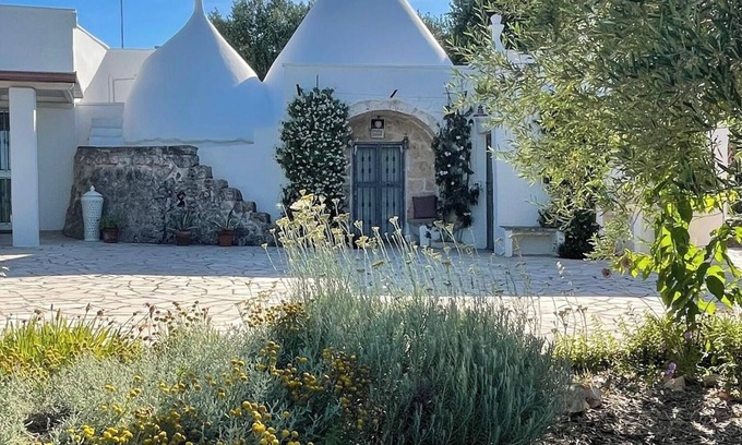 Ostuni Villa | An ancient Trullo surrounded by olive trees with a gorgeous saltwater pool