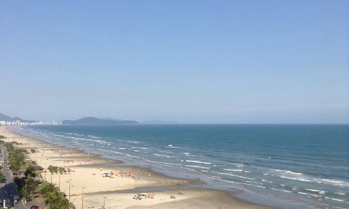 Praia Grande Apartment | Apartment facing the sea with barbecue on the balcony