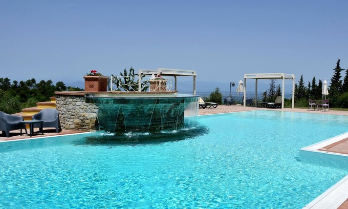 Chianni Villa | Apartment in villa with pool, WIFI, sauna, hot tub, TV, patio, pets allowed, panoramic view, parking