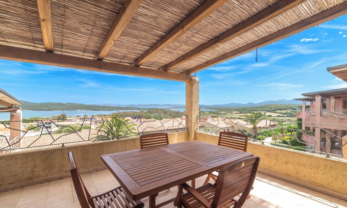 Porto Pozzo Apartment | Apartment 'Il Fiordo 27' with Sea View, Shared Pool and Air Conditioning