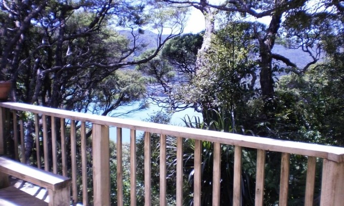 Tryphena House | Bach in quiet bush setting with sea views