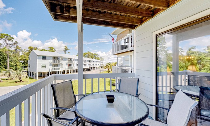 Orange Beach Condo | Bayfront condo with boat slips/launch, pool, tennis, & fishing pier - near beach
