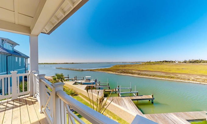 Rockport Villa | Bayfront resort villa with water view, pool, fishing pier, grills, & boardwalk