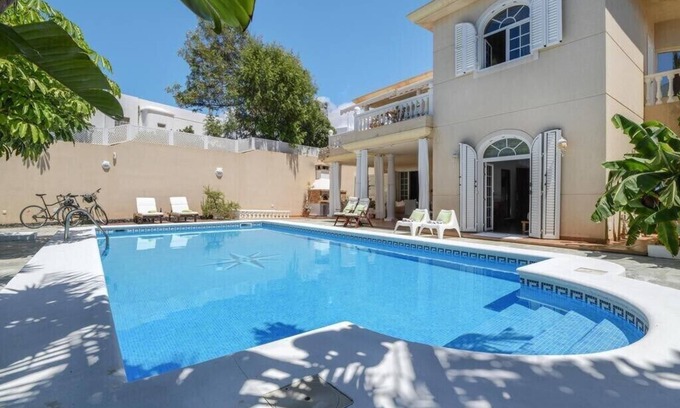 Playa del Cable Apartment | Bayside Concha House: Beachfront Oasis with Heated Pool