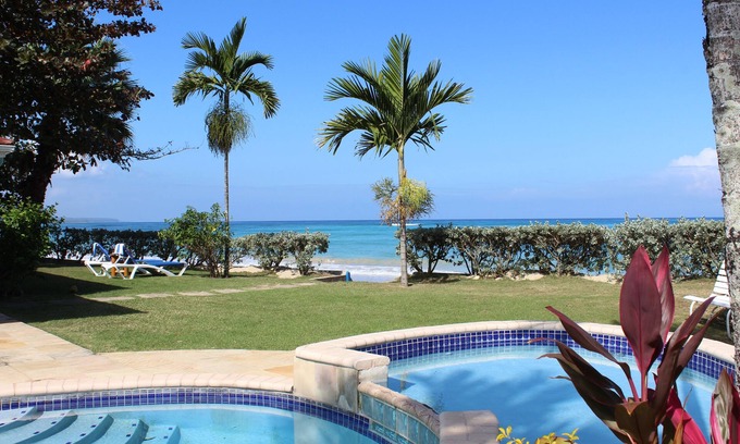 Runaway Bay Villa | Baywatch - seaside villa, modern, spectacular location & garden, pool, cook