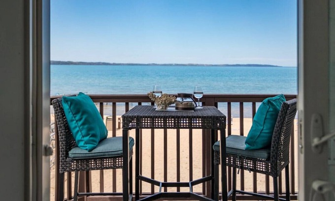 Traverse City Condo | Beach Bliss 211 Balcony Water Views Beach Downtown