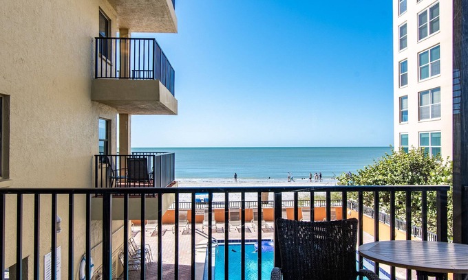 Madeira Beach Condo | BEACH LOUNGES AND UMBRELLA SERVICE INCLUDED! POOL IS OPEN AND PAVERS COMPLETED!