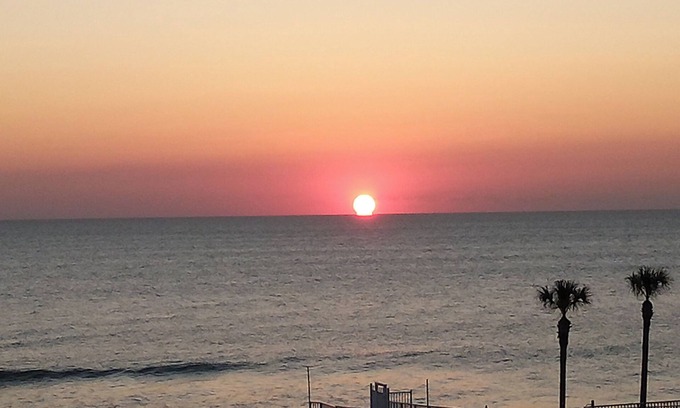 Daytona Beach Shores Condo | beach, pool, full kitchen and California king bed.