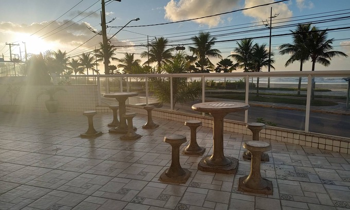 Praia Grande Apartment | Beachfront condominium, 1-bedroom apartment with views of the mountains and sunset