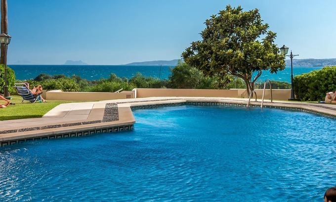 Estepona Apartment | Beachfront apartment with air-con, large sun-terrace (& loungers), WiFi & UKTV
