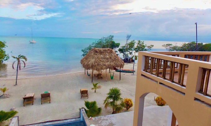 San Pedro Villa | Beachfront Home Events Celebrations Groups @ 8BR Private Beach, Palapa Pool Pier