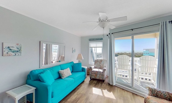 Morehead City Condo | Beachfront home with ocean-view balcony, two pools, waterslide, & beach access