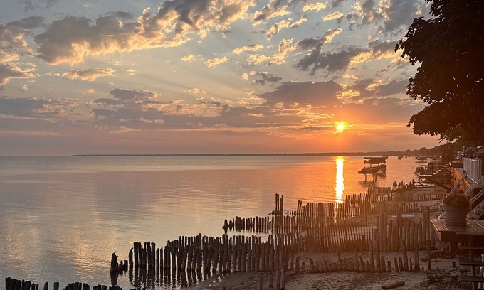 Caseville Township House | Beachfront lake house with large deck, beach bonfire & stunning views!