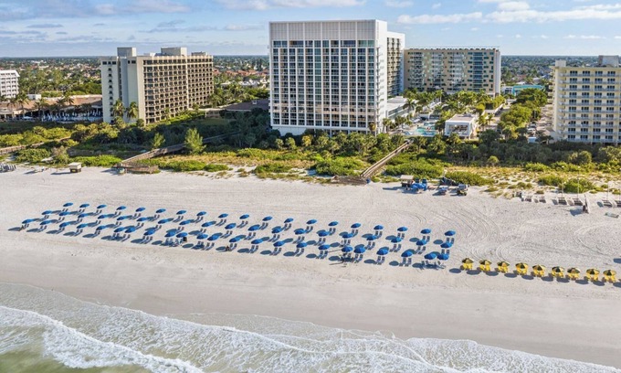 Marco Island Condo | Beachfront Resort. Access to Restaurant, Spa, Sauna, Water Slide, Games, Cabanas