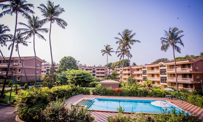 Candolim Apartment | Beachside Beauty in Regal Park, Candolim, Goa with Pool and Garden Views