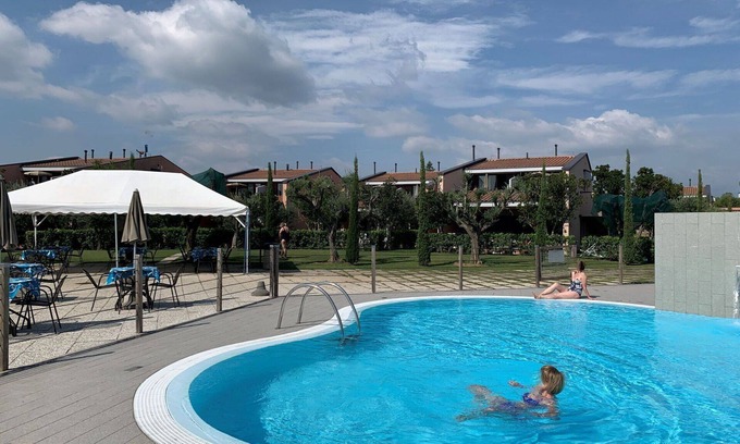 Moniga del Garda Apartment | Beautiful apartment for 2 guests with pool, WIFI, A/C, TV, balcony, pets allowed and parking