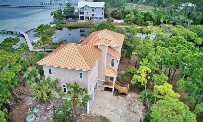 Plantation House | Beautiful Bayfront home with dock, elevator, private pool, & more.