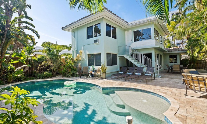 Birch Park Finger Streets House | Beautiful Beach House with pool, lush tropical landscaping steps from the ocean