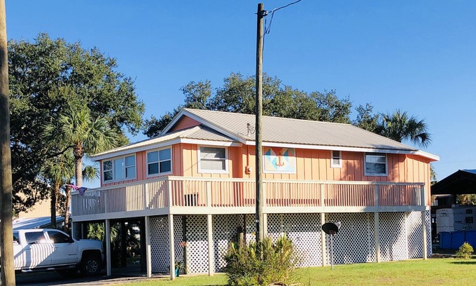 Horseshoe Beach House | Beautiful Canal Front, Nautical Theme Home with downstairs outdoor TIki Bar